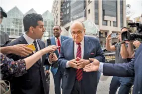  ?? NICOLE CRAINE/THE NEW YORK TIMES ?? In Atlanta, Rudy Giuliani walks to the Fulton County Courthouse in August on his way to appear before a grand jury.