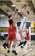  ?? ?? Pleasant Valley’s Gavin Garretson
(25) shoots a fadeaway with Chico’s Landon Kobz (44) and Jaiden Henry (13) defending in the Northern Section Division III championsh­ip on Friday at Butte College.