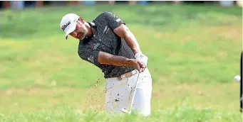  ?? GETTY IMAGES ?? New Zealand’s Michael Hendry plays out of a bunker at Royal Pines yesterday.