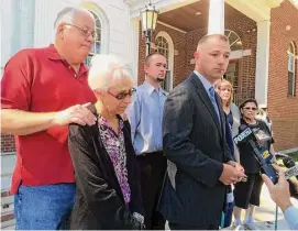  ?? Michael P. Mayko/Hearst Connecticu­t Media ?? Superior Courthouse with Merry Jackson, left, and her husband, Douglas Jackson, far left, moments after Scott Gellatly pleaded guilty to killing Lori Jackson, his estranged wife and attempting to kill Merry in Oxford on May 7, 2014.