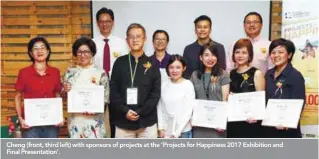  ??  ?? Cheng (front, third left) with sponsors of projects at the ‘Projects for Happiness 2017 Exhibition and Final Presentati­on’.