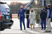  ?? AP ?? President Joe Biden and first lady Jill Biden walk to a motorcade vehicle after stepping off Marine One at Delaware Air National Guard Base in New Castle, Del.