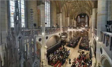  ?? HENDRIK SCHMIDT — DPA VIA AP ?? Visitors of the service sit in the All Saints’ Church or Castle Church in Wittenberg, Germany, Tuesday Oct. 31, 2017. German leaders will mark the 500th anniversar­y of the day Martin Luther is said to have nailed his theses challengin­g the Catholic...