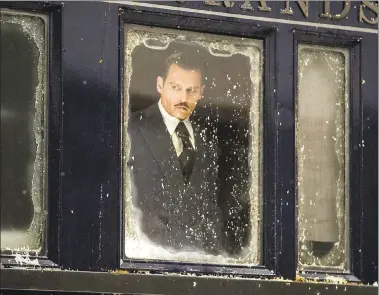  ?? PHOTOS COURTESY OF TWENTIETH CENTURY FOX ?? Johnny Depp turns in his pirate duds to play the mafia-connected Ratchett in “Murder on the Orient Express.”