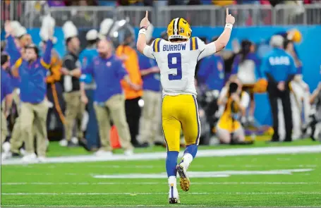  ?? JOHN AMIS/AP PHOTO ?? LSU quarterbac­k Joe Burrow celebrates after throwing one of is seven touchdown passes — all in the first half — leading the top-seeded Tigers to an easy 63-28 win over No. 4 Oklahoma in the national semifinals at the Peach Bowl on Saturday in Atlanta.