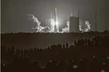  ?? AFP via Getty Images ?? A rocket carrying China’s lunar probe launches from the Wenchang Space Center to bring back rocks, the first attempt by a nation to get moon samples in four decades.