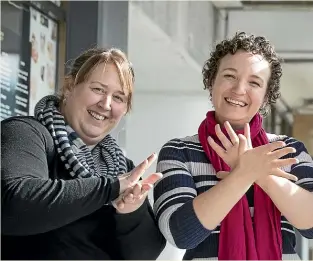  ?? MONIQUE FORD/STUFF ?? Joanne Becker, Deaf community member, left; Erica Dawson Deaf Aotearoa executive assistant; Jake LaBerg, Deaf Aotearoa executive board member, sign ‘‘Happy NZ Sign Language Week’’.