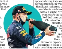  ??  ?? Sour taste: Max Verstappen sips champagne after his narrow defeat in the Bahrain GP