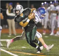  ?? Scott Mullin / For Hearst Connecticu­t Media ?? Norwalk quarterbac­k Kyle Gordon avoids a tackle in a game against Fairfield Ludlowe on Friday.