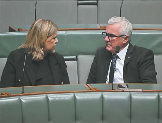  ?? AAP Image / Mick Tsikas ?? The Liberal member for Bass, Bridget Archer, speaks with the independen­t member for Clark, Andrew Wilkie, in the house on Wednesday.