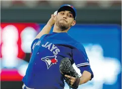  ?? JIM MONE / THE ASSOCIATED PRESS FILES ?? Toronto Blue Jays pitcher Marco Estrada. Rogers has hinted again it may be willing to sell the Jays.