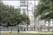  ?? JUAN LOZANO - THE AP ?? In this Thursday, Jan. 30 photo, Houston resident Guadalupe Ortiz takes her daily walk at a city park located across the street from her home and a Valero oil refinery. Houston’s lack of zoning has resulted in residents like Ortiz living next to petrochemi­cal facilities and businesses that handle hazardous substances.