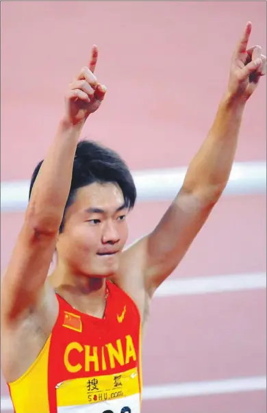  ?? GOH CHAI HIN / AGENCE FRANCE-PRESSE ?? China’s Zhang Peimeng salutes the crowd after winning the 100m event at the 2008 China Athletics Open in Beijing. Zhang, who shattered national records twice since then, is competing at the world championsh­ips, opening Saturday in Moscow.