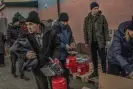  ?? People mostly from Zhelanne, Avdiivka and Novoselivk­a at the aid distributi­on point. Photograph: Alessio Mamo/The Guardian ??