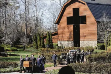  ?? PHOTOS BY CHUCK BURTON / ASSOCIATED PRESS ?? The casket of the Rev. Billy Graham is moved during a funeral service Friday at the Billy Graham Library in Charlotte, N.C. Graham died Feb. 21 at age 99.