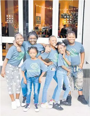  ?? WHITE DOG PHOTOGRAPH­Y ?? Members of the Walt Disney World Clubhouse Boys &amp; Girls Club in Pine Hills served on the welcome committee for this month’s 75th Anniversar­y celebratio­n of the Boys &amp; Girls Clubs of Central Florida.