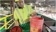  ?? Staff photo by Mallory Wyatt ?? ■ Operations Manager Calvin Poole shows a bucket of biological hazards that were put in recycling containers Friday at Waste Management’s Single Stream Materials Recovery Facility in Arlington, Texas.