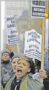  ?? AP PHOTO ?? A protester heads north along North Michigan Avenue on Friday.