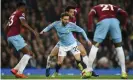  ??  ?? Bernardo Silva goes down under the challenge of Felipe Anderson. Photograph: Oli Scarff/AFP/Getty Images