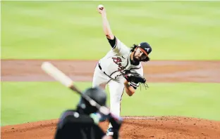 ?? BOB LEVEY/GETTY ?? Braves starter Ian Anderson didn’t allow a run in 52⁄ innings Wednesday.
3