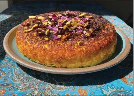  ?? COURTESY OF HELIA SADEGHI ?? The showstoppi­ng Persian savory rice “cake” known as tahchin is perfect for Nowruz celebratio­ns, says Helia Sadeghi of Oakland's Big Dill Kitchen.
