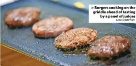  ?? Katie Mortimore ?? Burgers cooking on the griddle ahead of tasting by a panel of judges