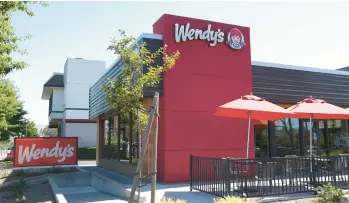  ?? GETTY 2022 ?? The Wendy’s fast-food chain is looking to expand to Australia, where another eatery already uses the name.