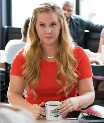  ??  ?? mInI makeover After an accident, Renee (Amy Schumer) feels differentl­y about herself (above).