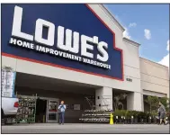  ?? (AP) ?? Customers wear masks in March as they enter a Lowe’s home improvemen­t store in Los Angeles. Lowe’s officials say the retailer will not allow its workers to enforce the company’s new mandate that all shoppers wear facial coverings.