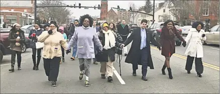  ?? Cassandra Day / Hearst Connecticu­t Media ?? The 25th annual Martin Luther King Jr. birthday celebratio­n Monday began with a procession down Main Street in Middletown and ended with a program at First Church of Christ. Here Middletown Mayor Dan Drew, third from left, joined members of the...