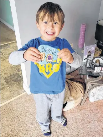  ?? CONTRIBUTE­D PHOTOS ?? Owen Brown proudly holds up a painted rock he found made by the Shelburne NS Rocks group.