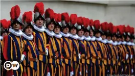  ?? ?? The Pope's army: The Swiss Guard are an elite military corps — and yes, they have to be Swiss citizens
