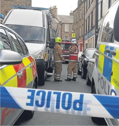  ?? Picture: Mhairi Edwards. ?? Forfar town centre was placed on lockdown on April 26 following the delivery of a politicall­ymotivated letter to the Angus Council municipal buildings.