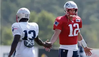  ?? NANCY LANE / BOSTON HERALD ?? TRUST FACTOR: Phillip Dorsett (13), who is battling for a spot on the Patriots roster at wide receiver, has been a reliable target for Tom Brady in the past.