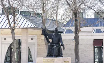  ??  ?? A statue of Muslim philosophe­r, writer and humanist Ahi Evran on his mosque-tomb complex in Kırşehir, central Turkey, Feb. 24, 2021.