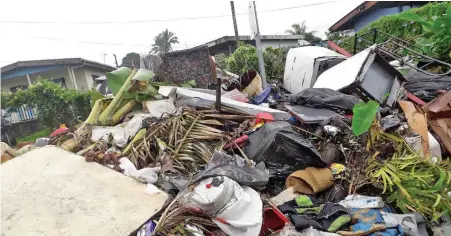  ?? Photo: Sereana Salalo ?? Rubbish along Matau Rd, Caubati, yet to be collected by the Nasinu Town Council.