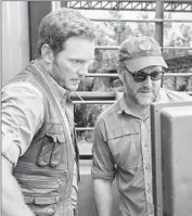  ?? Chuck Zlotnick
Universal Pictures ?? CHRIS PRATT, left, the f ilm’s lead actor, confers with its 38-year-old director, Colin Trevorrow, on set.