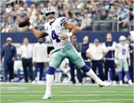  ?? AP Photo/Eric Gay ?? ■ Dallas Cowboys quarterbac­k Dak Prescott (4) passes in the second half against the Detroit Lions on Sunday in Arlington, Texas.