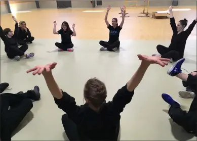  ?? RICHARD PAYERCHIN — THE MORNING JOURNAL ?? Spectrum Resource Center and School students get to know North Pointe Ballet Artistic Director Janet Dziak, Assistant Director Melaina Kampf and instructor Elizabeth Radachi during a rehearsal Feb. 19 at the school gymnasium in Lorain.