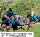  ?? ?? Police centre Akash Madushanka lands a try - Pic by Akila Jayawarden­a