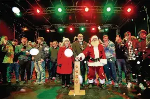  ??  ?? ●●The then Mayor, Santa and the Rochdale Hornets rugby team switching on the Christmas lights last year