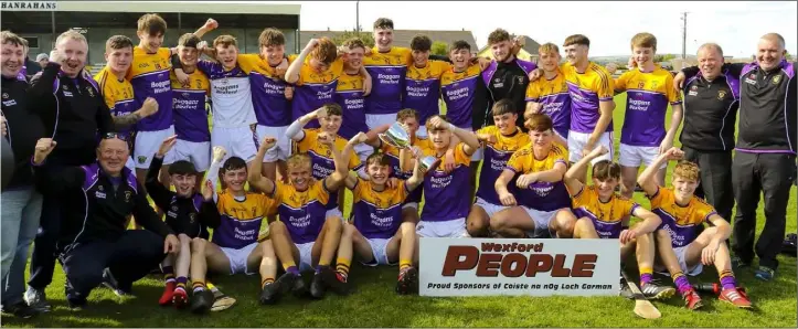  ??  ?? The Faythe Harriers players celebrate with mentors Francis Byrne, Peter Cassin, Brian Walsh, Tommy Hynes and Nicky Lawlor after victory in Saturday’s epic Wexford People MHC Premier final.