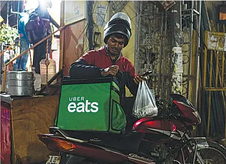  ?? A surge in the popularity of food delivery apps such as Uber Eats, Swiggy and Zomato has led to questions about workers’ rights in India’s growing gig economy. ??