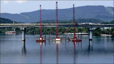  ??  ?? The Olgiati Bridge crosses the Tennessee River in downtown Chattanoog­a. This year Tennessee lawmakers raised the state’s gas tax in order to pay for infrastruc­ture improvemen­ts. ©The Associated Press