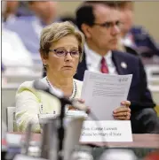  ?? DARRON CUMMINGS / AP ?? Indiana Secretary of State Connie Lawson reads notes that were handed out on voter registrati­on during the National Associatio­n of Secretarie­s of State conference on Saturday in Indianapol­is.