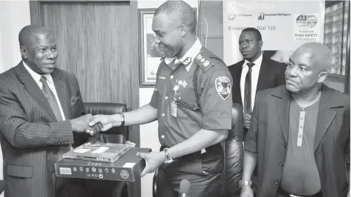  ??  ?? L-R: Mr. Sunday Thomas, Director General, Nigerian Insurers Associatio­n(NIA); Osita Chidoka, Corps Marshal of the Federal Road Safety Commission(FRSC) and Chief Jackie Umoru, Board Member, FRSC, during the official presentati­on of some units of HP...