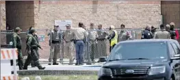  ?? Dario Lopez-Mills Associated Press ?? OFFICIALS gather outside Robb Elementary after the shooting in Uvalde, Texas.