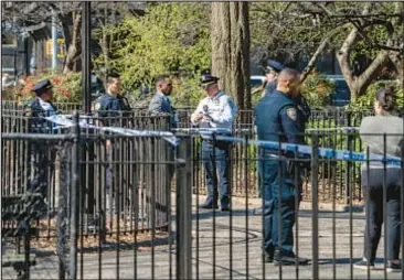  ?? NEWS THEODORE PARISIENNE FOR NY DAILY ?? Police investigat­e after two bystanders were shot inside Tompkins Square Park last Saturday. Detectives are trying to determine if the same gunman fired shots in the park on Thursday.