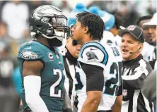  ?? David T. Foster III / Charlotte Observer ?? Carolina safety Eric Reid (right) has words for Philadelph­ia safety Malcolm Jenkins prior to kickoff.