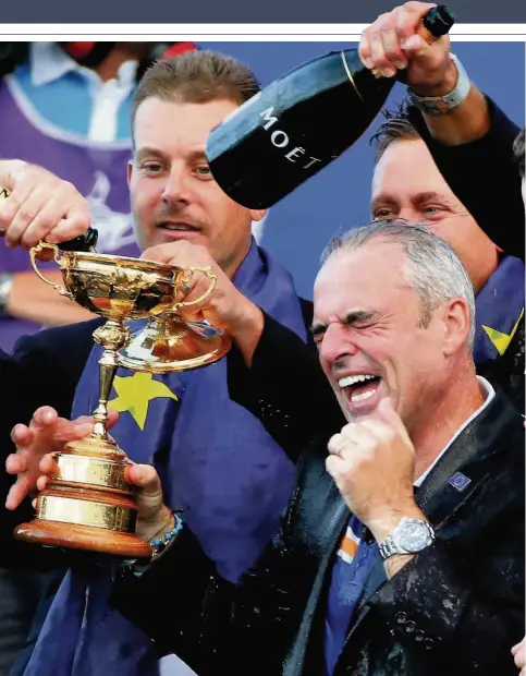  ??  ?? JUST CHAMPION Paul McGinley celebrates the Ryder Cup win at Gleneagles in 2014 and won’t write off a Europe success